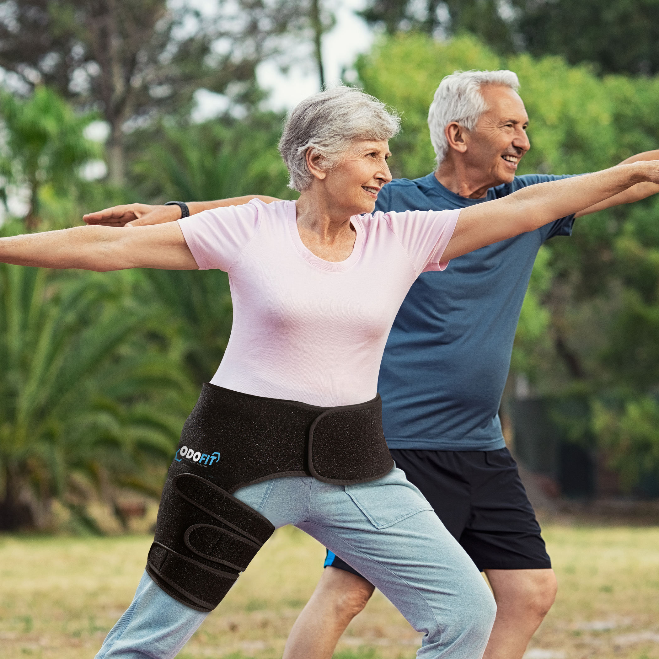 Older couple wearing the ODOFIT hip brace stretching outdoors before exercise